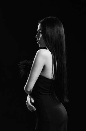 Elegant sexy woman. Black Friday advertising. beauty salon for real woman. Portrait of young woman in black dress. wearing dress for special occasion. attractive glamour girl. girl black backgroundの写真素材