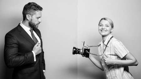 Businessman enjoy star moment. Photographer taking photo successful businessman. Paparazzi concept. Photosession for business magazine. Handsome businessman posing camera. Nice shot. Fame and successの写真素材