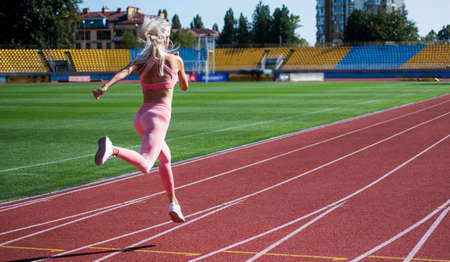 energetic and sporty. marathon speed energy. woman in motion. athletic ladyの写真素材