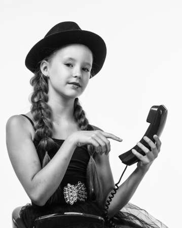 communication. child having phone conversation. happy childhood. beauty and fashion.の写真素材