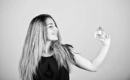 be yourself. pretty woman hold perfume. elegant smell. cosmetic care. woman with bottle of perfume....