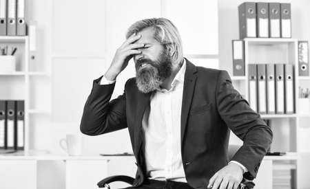 Job one of biggest stressors in life. Stress reduction mechanisms. Business man suffer headache. Businessman feel pain headache. Stressful life. Experience frequent headaches or migraine attacksの写真素材