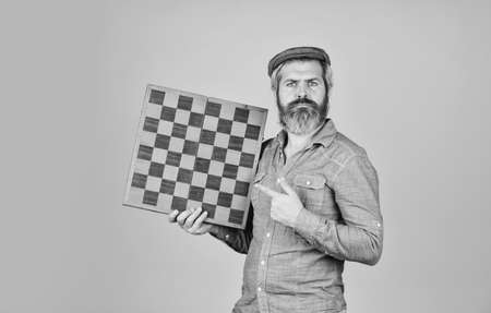 strategy ideas concept. bearded man hold chess board. intelligence quotient. human brain working. brainstorming concept. play chess tournament. Intelligence level measurement. level up your iqの写真素材