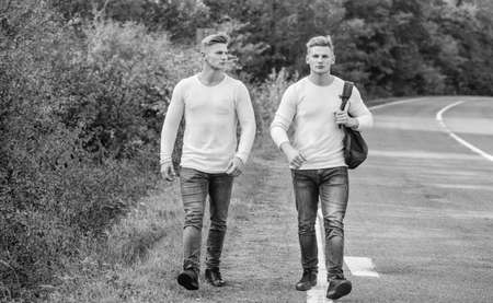 Guys hitchhiking on road. Tourist traveler travel auto stop. Transporting issues. Pick spot where...