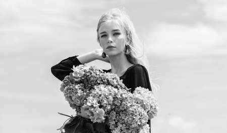 Spring attributes. Enjoy spring without allergy. Allergy free life. Stop allergy blooming season. Springtime bloom. Female adore flowers. Girl tender blonde hold hydrangea bouquet. Pollen allergyの写真素材