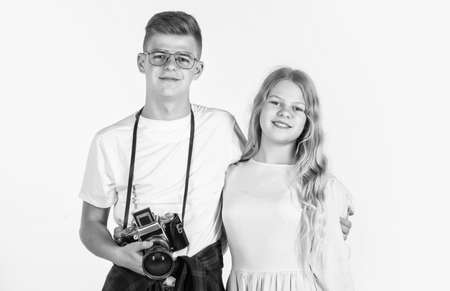 children with camera. photographer. kids friendship concept. hobby. family day. teen boy and girl