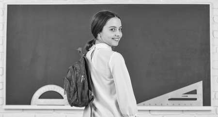 My backpack is just right. Girl in school classroom copy space. School project. Clever teenager student. Educative activity. Child study in school. Smart schoolgirl. School education. Knowledge dayの写真素材