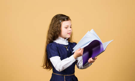 searching for information.knowledge and education. Back to school. hometwork. serious small girl...