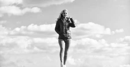 Fashion outfit. Windy day. Girl red jacket cloudy sky. Wind of changes. Female psychology. Woman...
