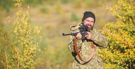 Focus and concentration of experienced hunter. Hunting masculine hobby concept. Man brutal...