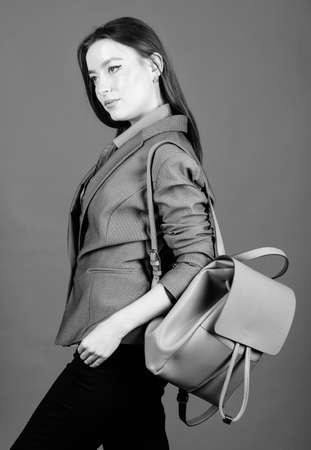 female bag fashion. business. Shool girl with knapsack. girl student in formal clothes. student life. Smart beauty. Nerd. stylish woman in jacket with leather backpack. Enjoying student lifeの写真素材
