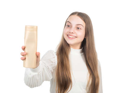 presenting cosmetic product for teen. kid use shower gel. child cleaning hair with shampoo.の写真素材