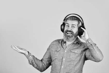 listen audio book. Music beat for energetic mood. his favorite song. enjoy excellent sound song in earphones. good mood playlist. Man with headset. copy space. bearded man hipster in headsetの写真素材