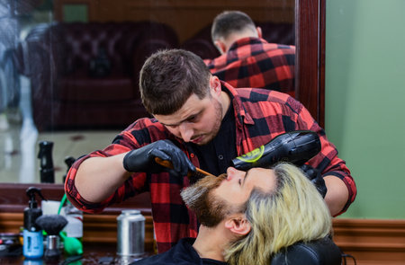 Another beauty treatment. hair and beard care. confident and handsome brutal man.の写真素材