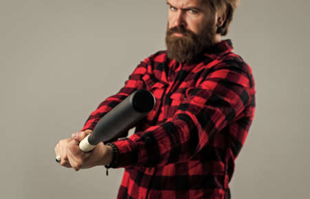 Practice hit technique. man reliving stress. emotion control concept. brutal bearded man using baseball bat for fighting. man swung the bat. bandit gang and conflict. sport. street hooligan with batの写真素材