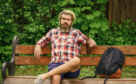Modern hipster relaxing. You deserve fine relax. Craft beer. Hipster bearded man hold cold fresh...