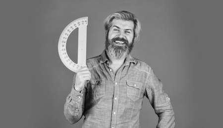 Study hard. Back to school. Teacher of stem. Calculation and data. Measurement tool. Measuring angle. School education. Free education. Teaching you. Bearded man use protractor. Education conceptの写真素材