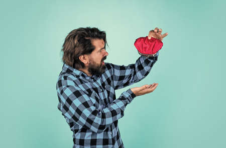 brutal bearded male with stylish look hold wallet, moneyの写真素材