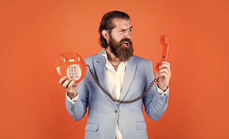 bearded man in formalwear speak on retro phone. elegant businessman has business talk. communication. true gentleman with groomed hair hold vintage telephone. nice conversationの写真素材
