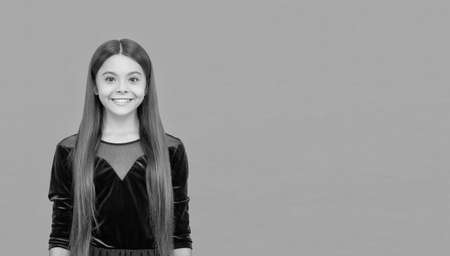 Smile to make lasting impression. Happy kid orange background. Dental health. Oral hygiene. Teeth decay prevention. Pediatric dentistry. Modern dental care, copy space.の写真素材