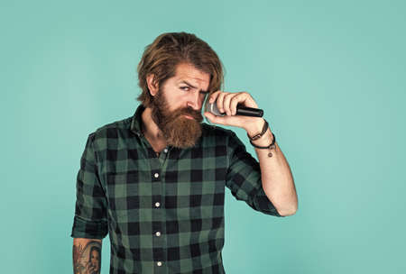 casual fashion styled singer. modern looking bearded hipster with mic. music concept. brutal...