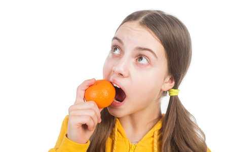 cheerful child with citrus fruit mandarin full of vitamins isolated on white, wellnessの写真素材
