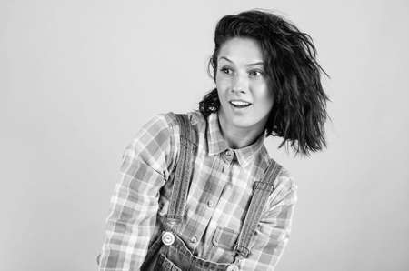 cheerful lady in shirt denim style on blue background, beautyの写真素材