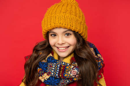 female fashion model. teen girl in scarf. portrait of child wearing warm clothes.の写真素材