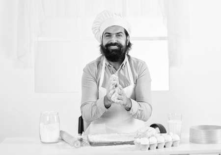 bearded man cook preparing food in home kitchen, chef