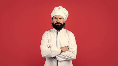 handsome hipster with beard and moustache crossed hands, culinaryの写真素材