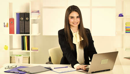 Pretty woman notary at work laptop. Bank worker. Business challenges. Licensed notary. Notaries and...
