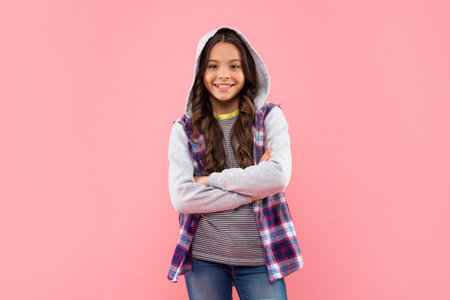 smiling child in checkered shirt with hood on pink background, hipsterの写真素材