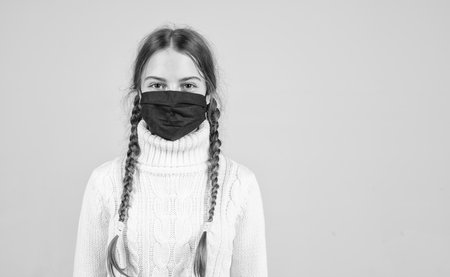 stay at home. symptom of covid 19. girl need igg immunity test. virus pneumonia. copy space. patient child wearing respirator mask. safety protective items during coronavirus pandemic outbreakの写真素材