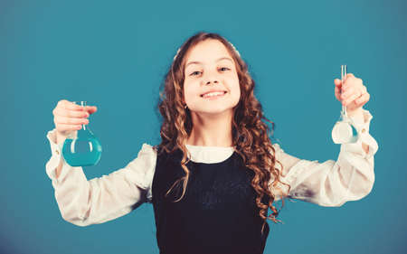 child study bilogy lesson. education and knowledge. Future. science research in lab. Small school girl. back to school. small girl scientist with testing flask. Improving modern medicineの写真素材