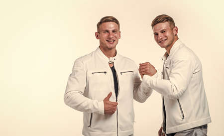 young twin brothers with similar appearance, togetherness