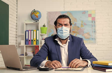young man wearing a medical face mask that protects from quarantineの写真素材
