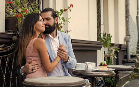 girlfriend with her boyfriend. lovely morning. happy valentines day. stylish couple in love embrace in cafe. man and woman on romantic date. romance. young family relations. loving relationshipの写真素材