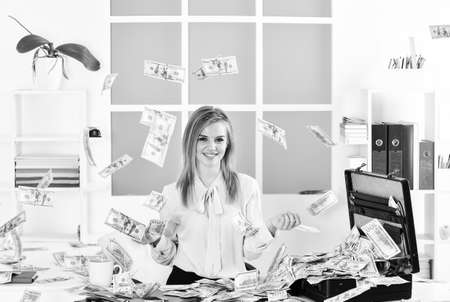 Finances is my passion. Girl with briefcase full of cash. Financial achievement. Business challenge. Accounting and banking. Smart blonde earn lot of money. Financial success. Financial expertの写真素材