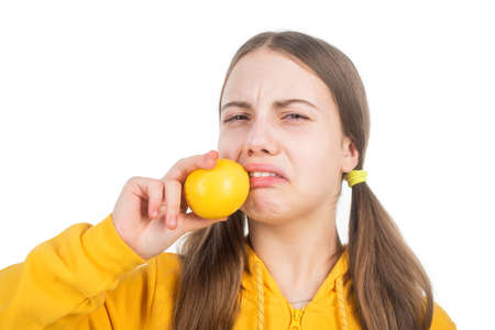 kid with sour citrus lemon fruit full of vitamins isolated on white, nutrients