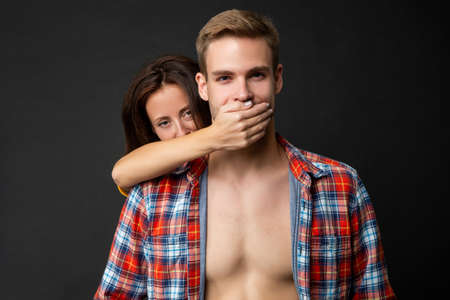 woman close mouth of man. guy and girl together. togetherness.