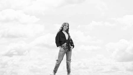 Ambitious and beautiful. cheerful teen girl has long curly hair. kid smiling outdoor. kid fashion...