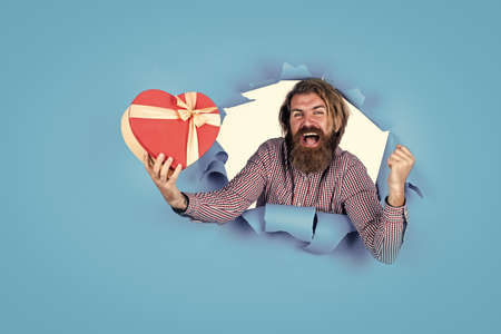 share his heart. best birthday present. be my valentine. man with gift box. guy with beard hold...