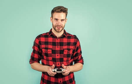 bearded man with bristle play video game with remote. fashion and beauty. barbershop concept....