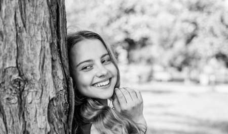 Always smiling. Happy girl smile at tree on summer landscape. Dental health. Oral care products....