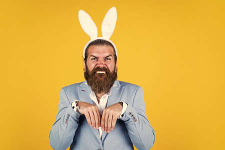 happy easter. spring holiday and party. funny bearded hipster in bunny ears. celebration concept....