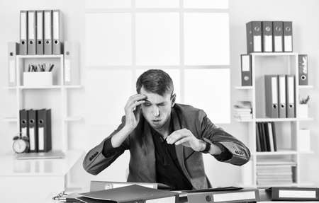businessman working in office with headache. male manager work on laptop. Busy man in modern workplace. boss or employee. being professional secretary. skilled and successful ceo. Do It Nowの写真素材