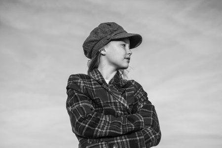 stylish kid wear trendy french cap on sky background. retro autumn fashion look.