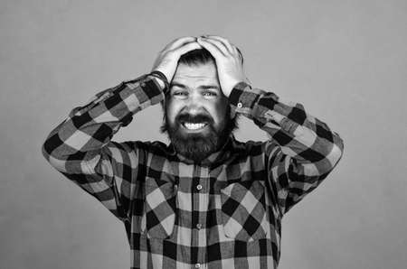 too painful for me. suffering man in checkered shirt. man has headache on orange background. brutal bearded hipster feel pain. mature guy with moustache on face. expressing human emotionsの写真素材