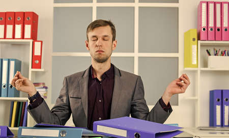 Man formal suit work office financial analyst economy crisis management, meditation and peace conceptの写真素材