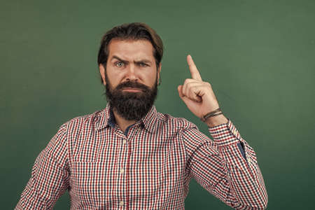 brutal unshaven guy university lecturer at chalkboard, inspirationの写真素材